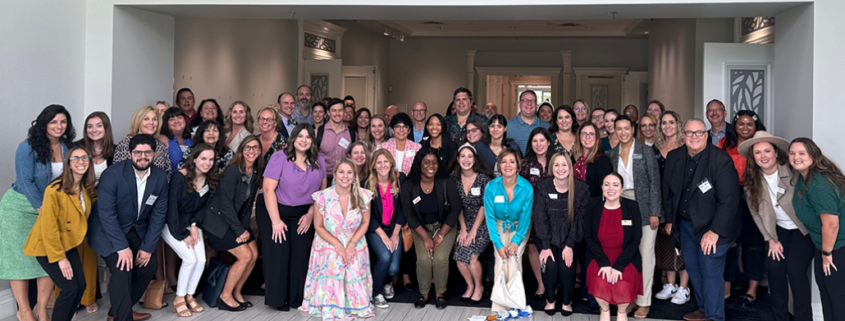 A large group of more than 40 PR professionals posing for a photo at media mashup 2023